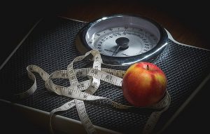 Tape and apple on weight scale