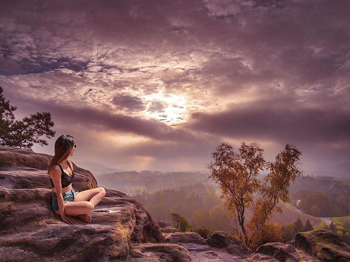 girl meditate sun clouds mountains