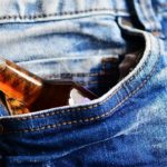 bottle of alcohol in the pocket