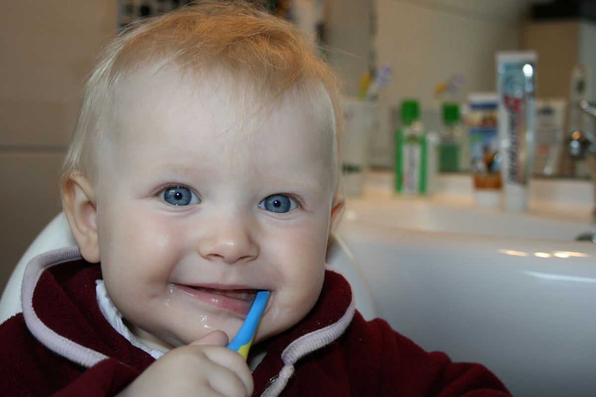 cute kid brushing teeth